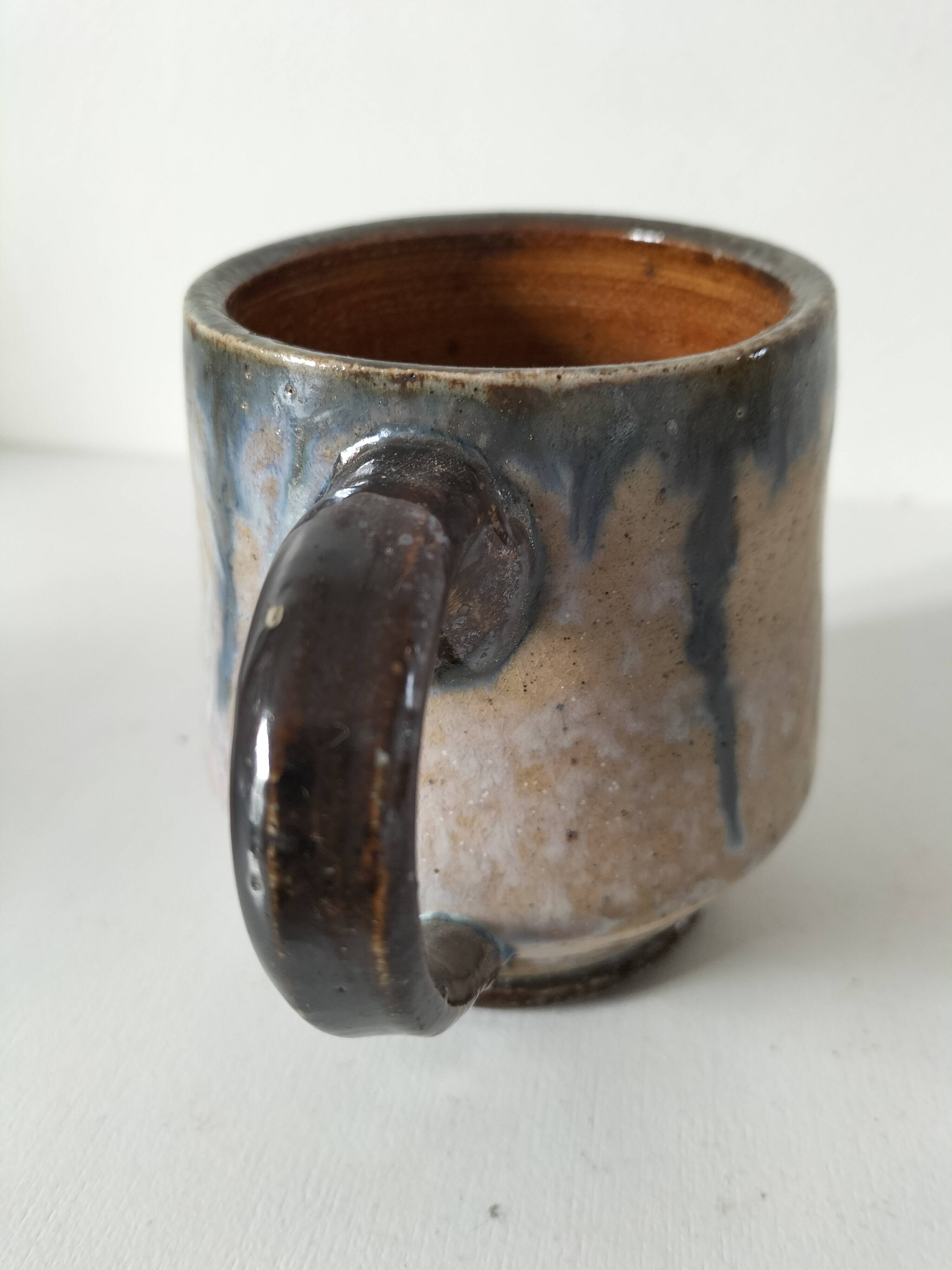 Fleur-de-lis glazed earthenware mug