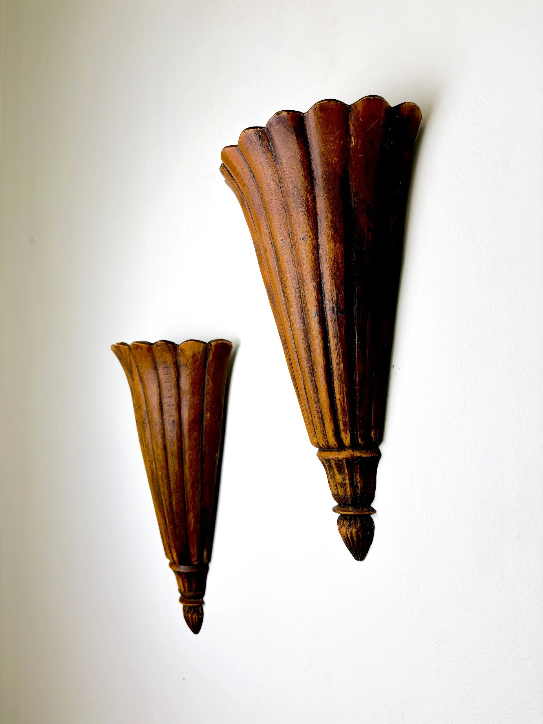 Pair of Art Deco carved wood wall sconces, France, 1930s