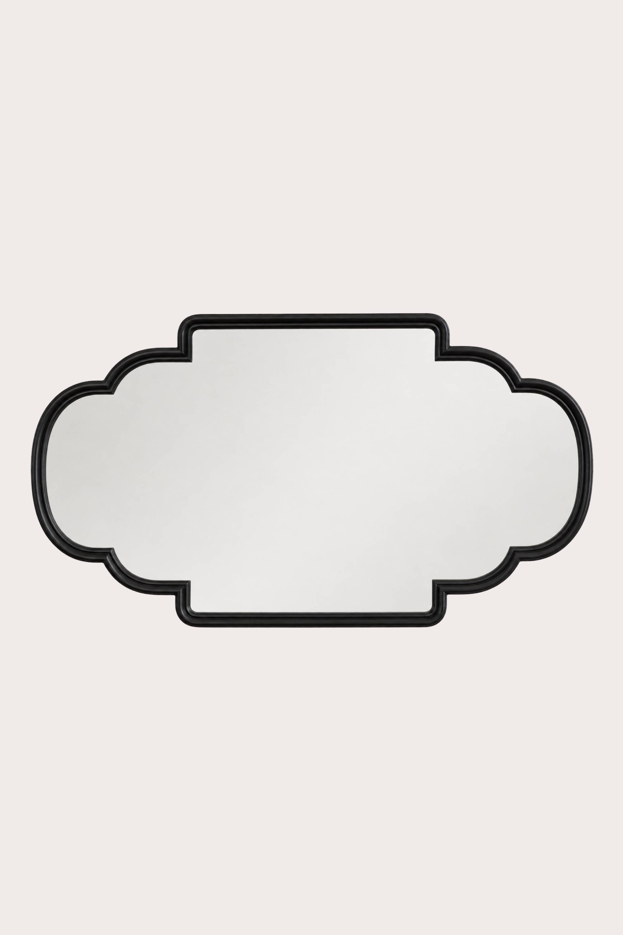 Cut-out mirror with a black frame
