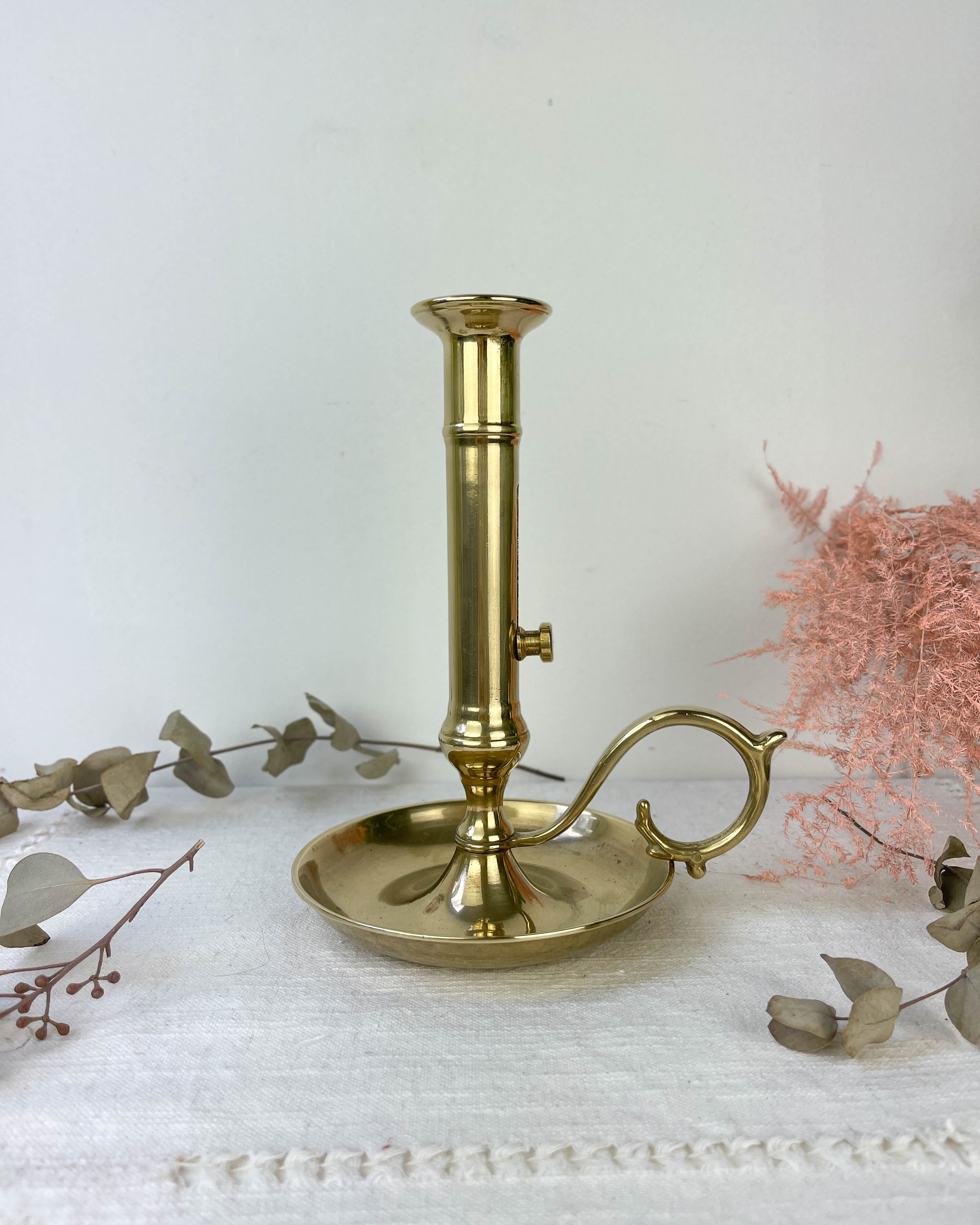 Brass candle holder with pusher late nineteenth century