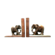 Art Deco bookends wooden elephants and bones on wooden terrace, book shape