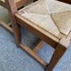 6 solid oak chairs with rush seats in a country style.