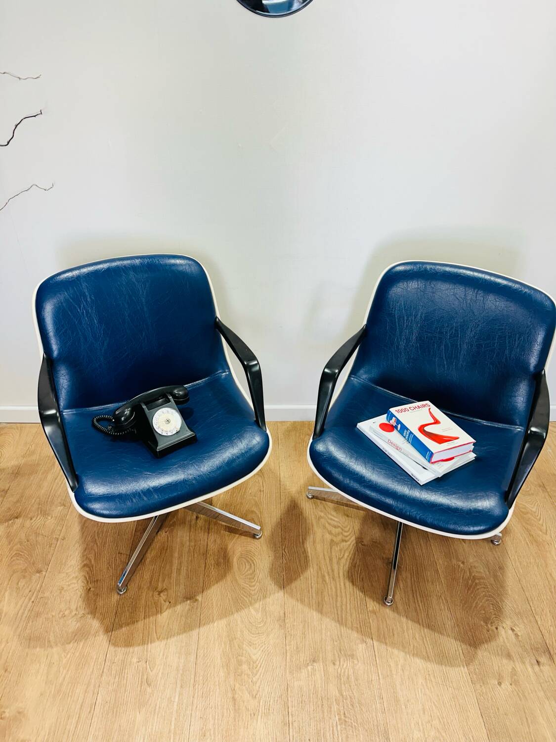 2 office chairs attr. to Strafor, white molded plastic shell, blue skai and chrome metal star base