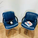 2 office chairs attr. to Strafor, white molded plastic shell, blue skai and chrome metal star base