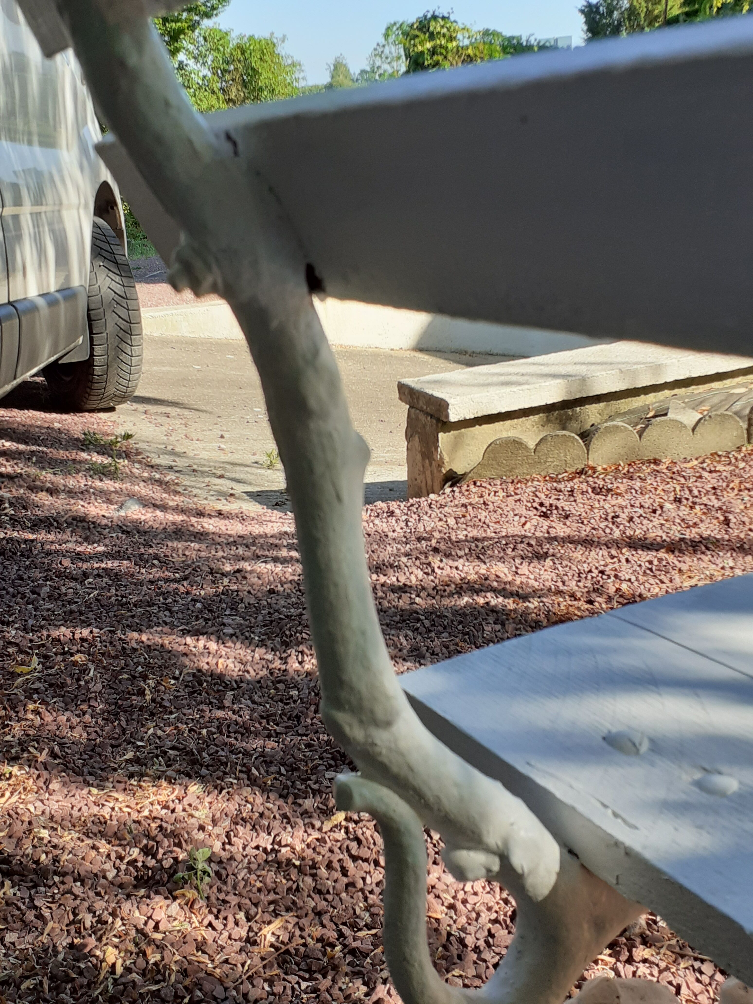 Old garden bench with cast iron feet and wooden planks