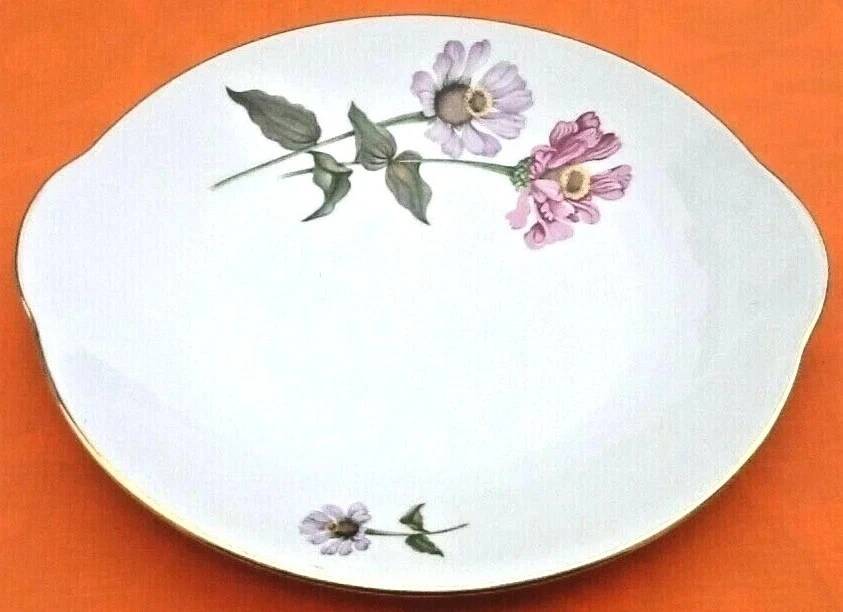 Serving dish with handles, fine Bohemian porcelain with floral decoration on a background.