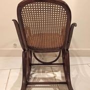 Vintage rocking chair for children in dark rattan and canework, rocking chair