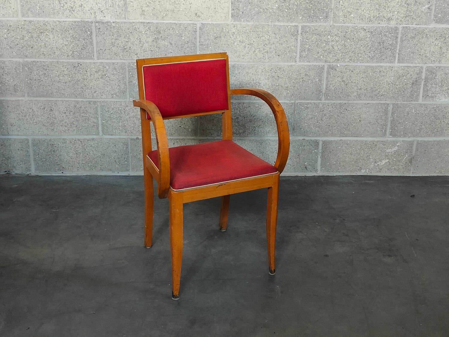 Small red bridge chair with armrests