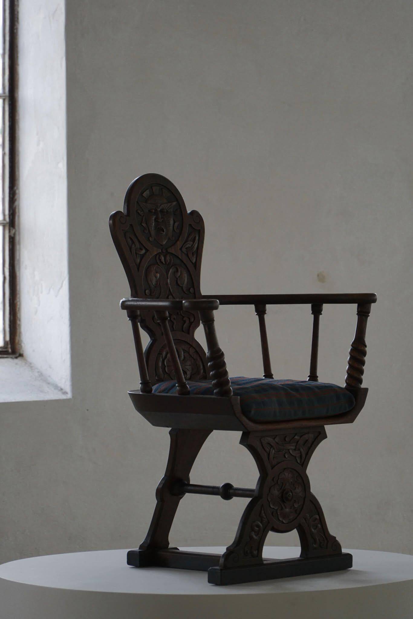 Scandinavian armchair in solid oak with cushion, folk art, early 19th century.