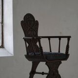 Scandinavian armchair in solid oak with cushion, folk art, early 19th century.