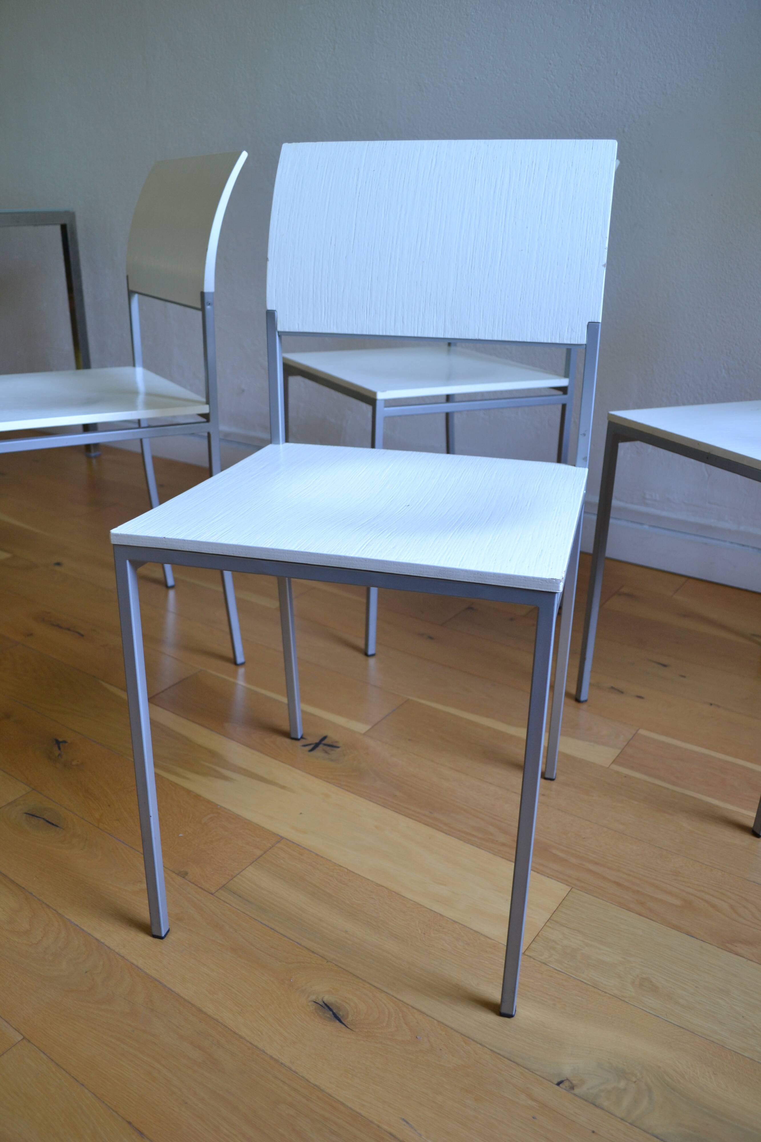 Set of 4 vintage metal and wood chairs from the 1990s.