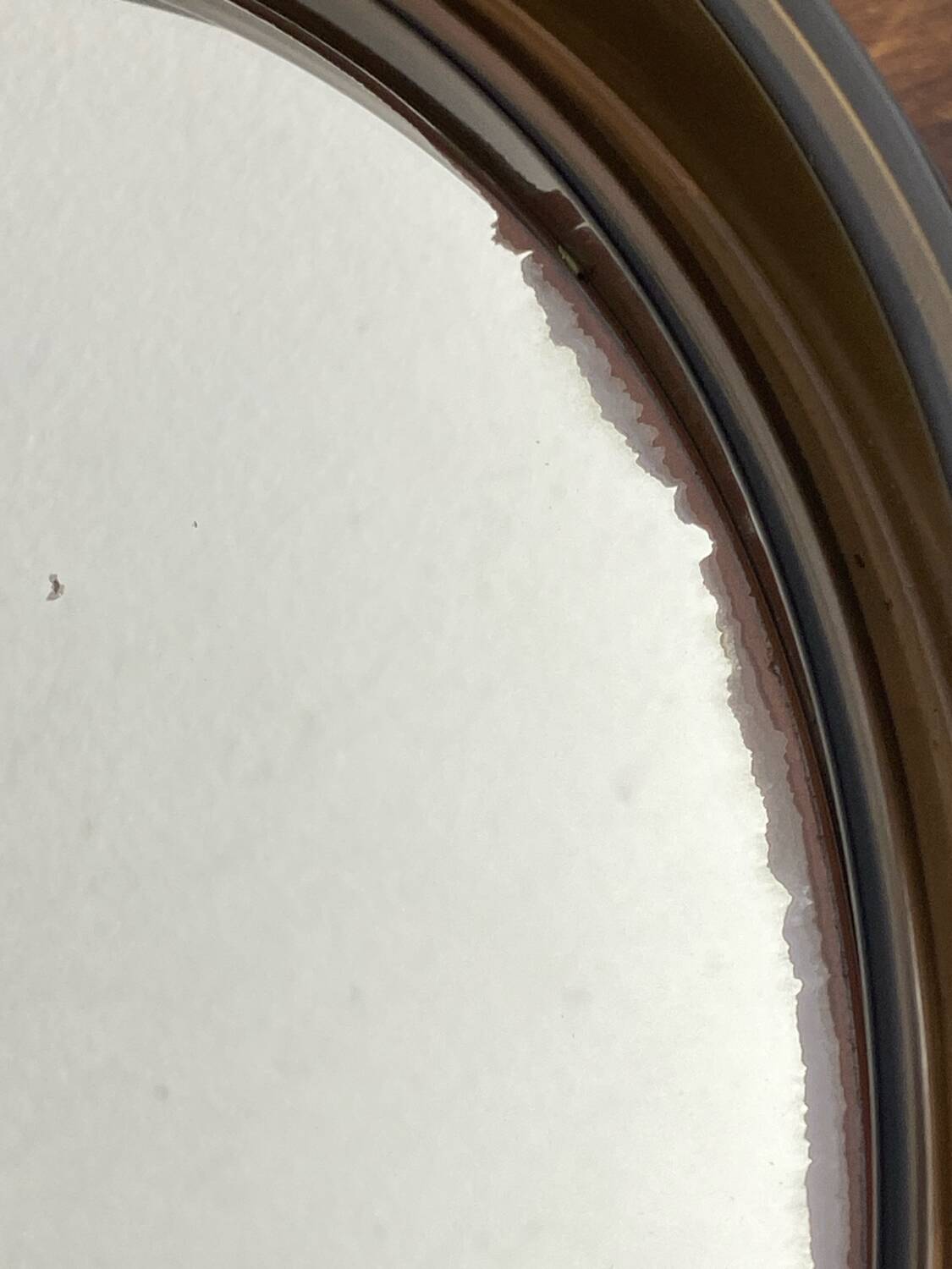 Circular mirror, smoked plastic, 1960s/70s.