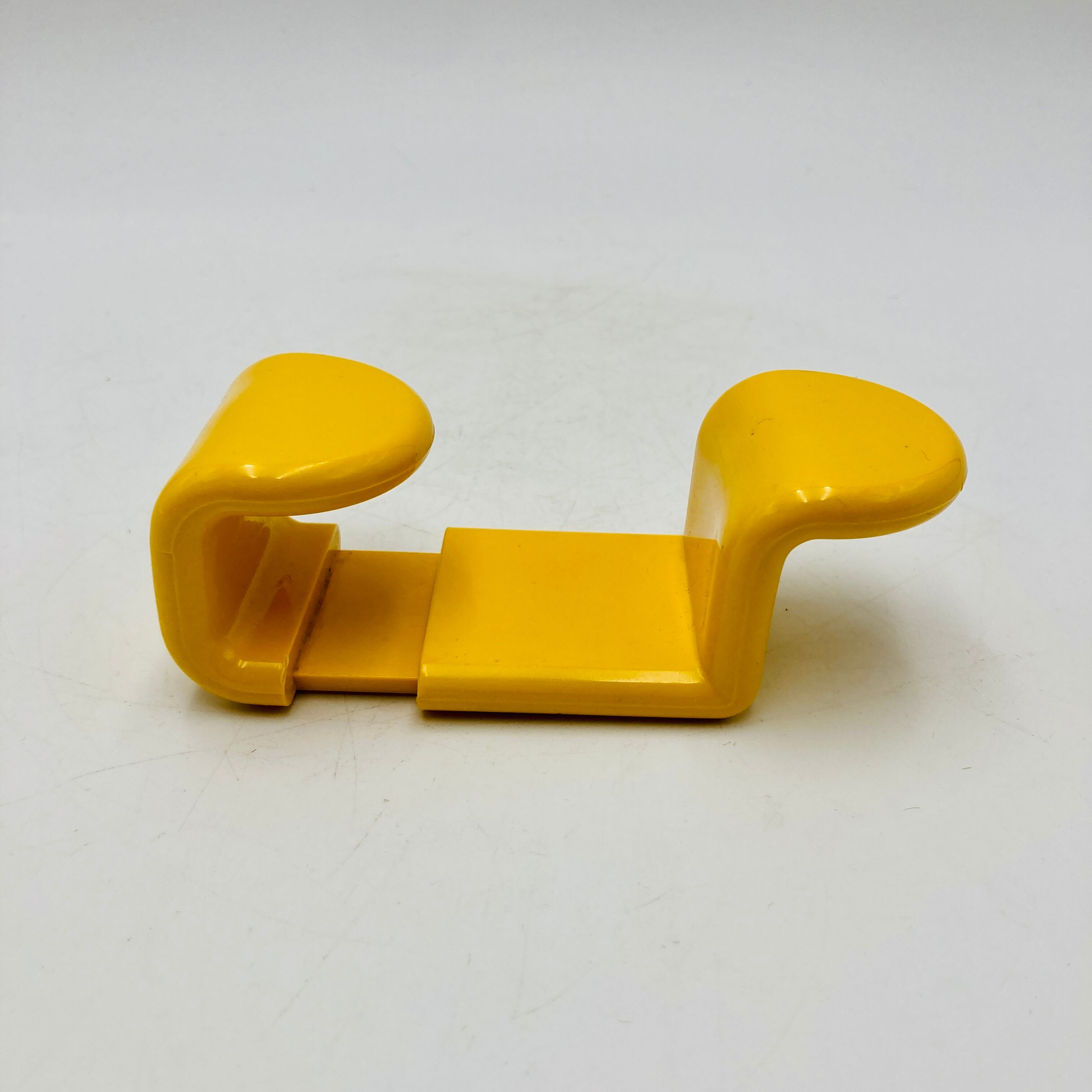 Yellow plastic hooks, design A. Rossari, Gedy edition.