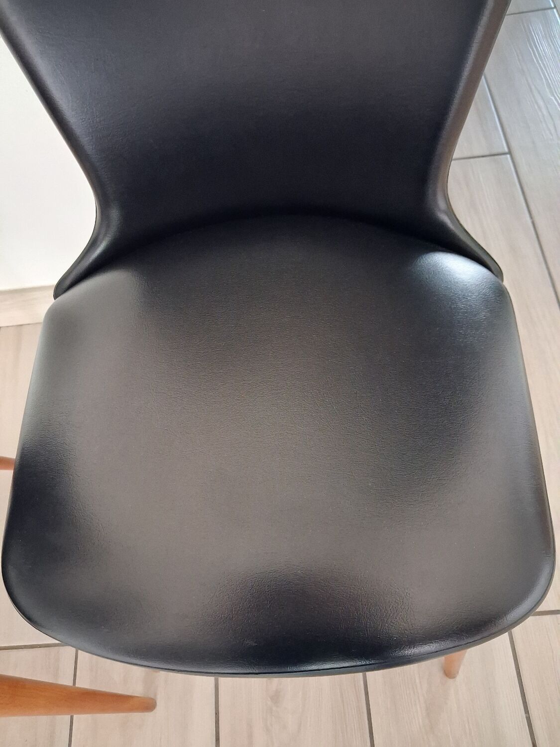 4 black Baumann style chairs