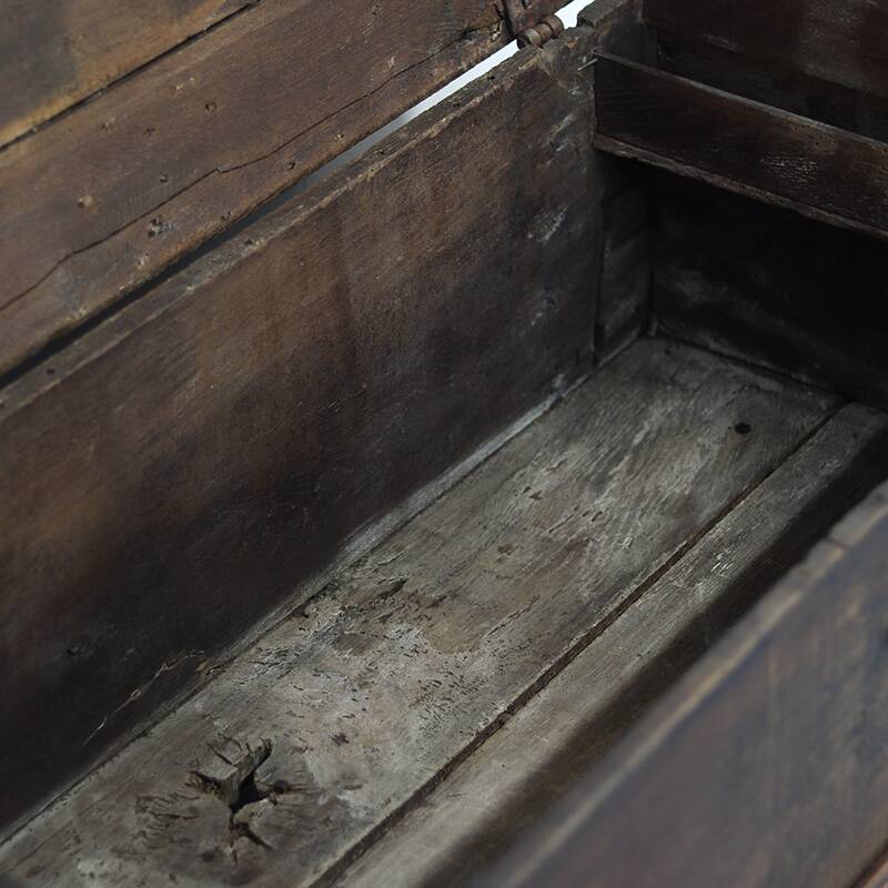 Rustic and weathered antique oak chest from the 18th century.