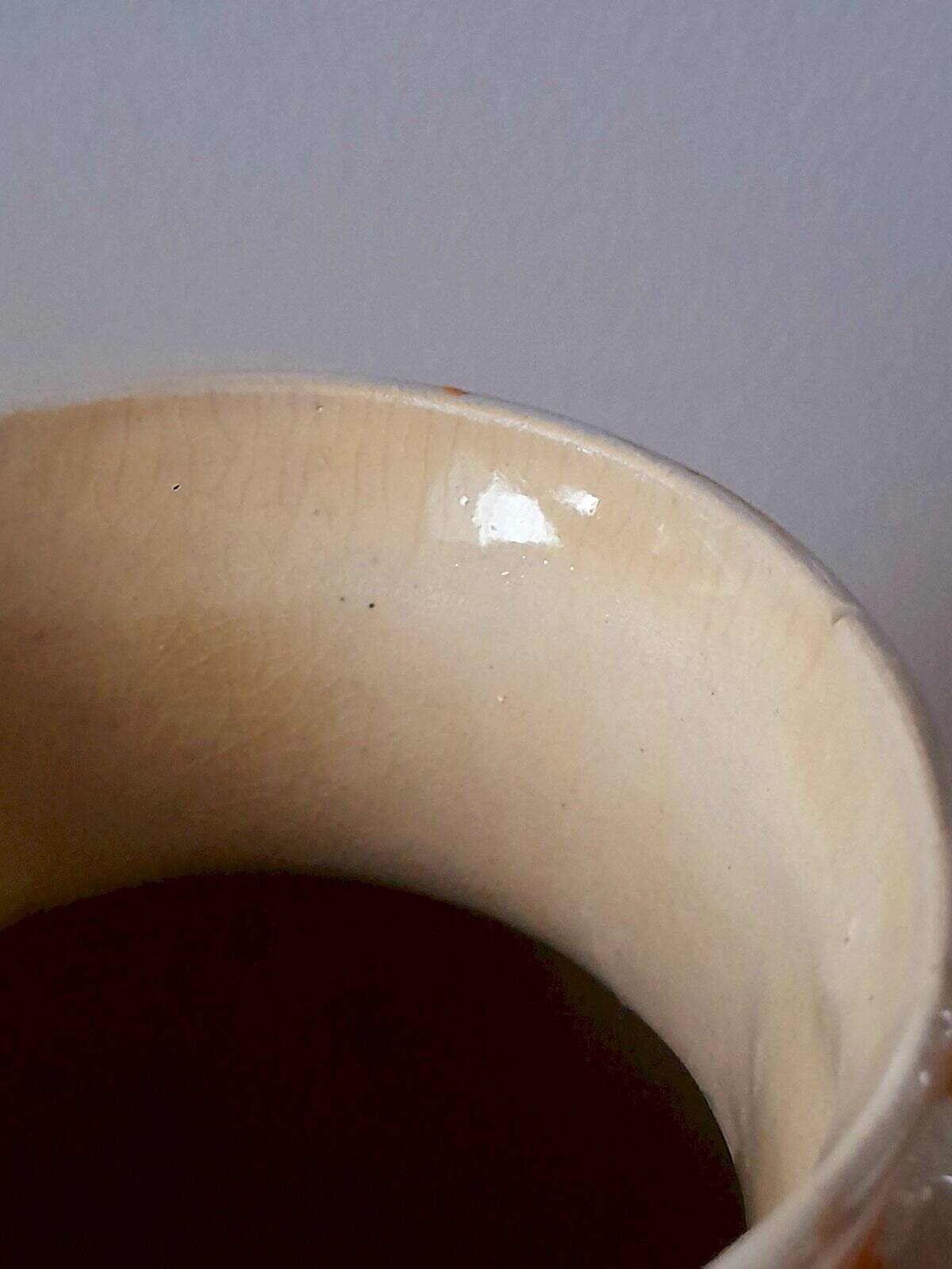 Old enamelled ceramic jug