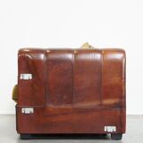 Luxurious and spacious two-seater sheepskin sofa of top quality with fabric cushions