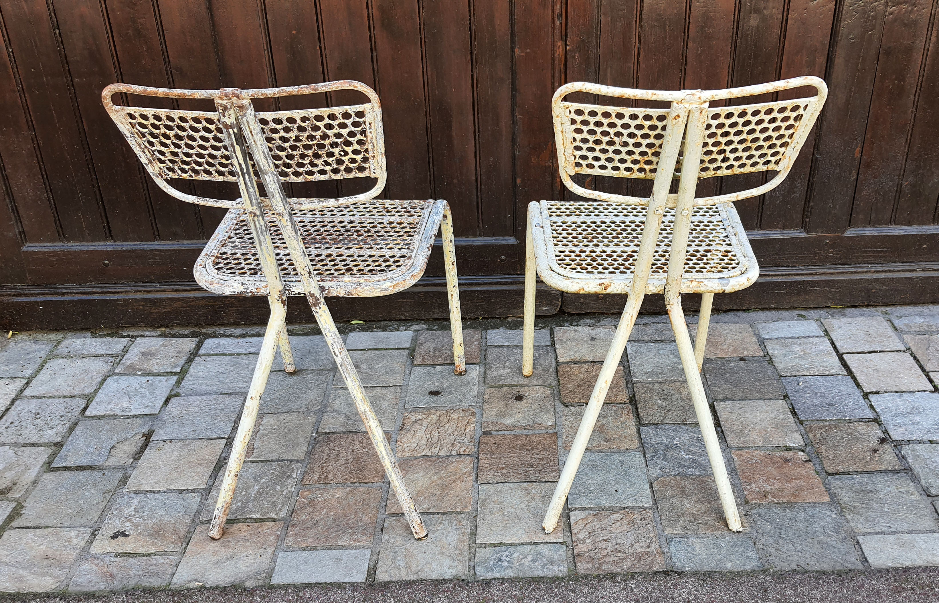 Perforated metal chairs René Malaval 1950