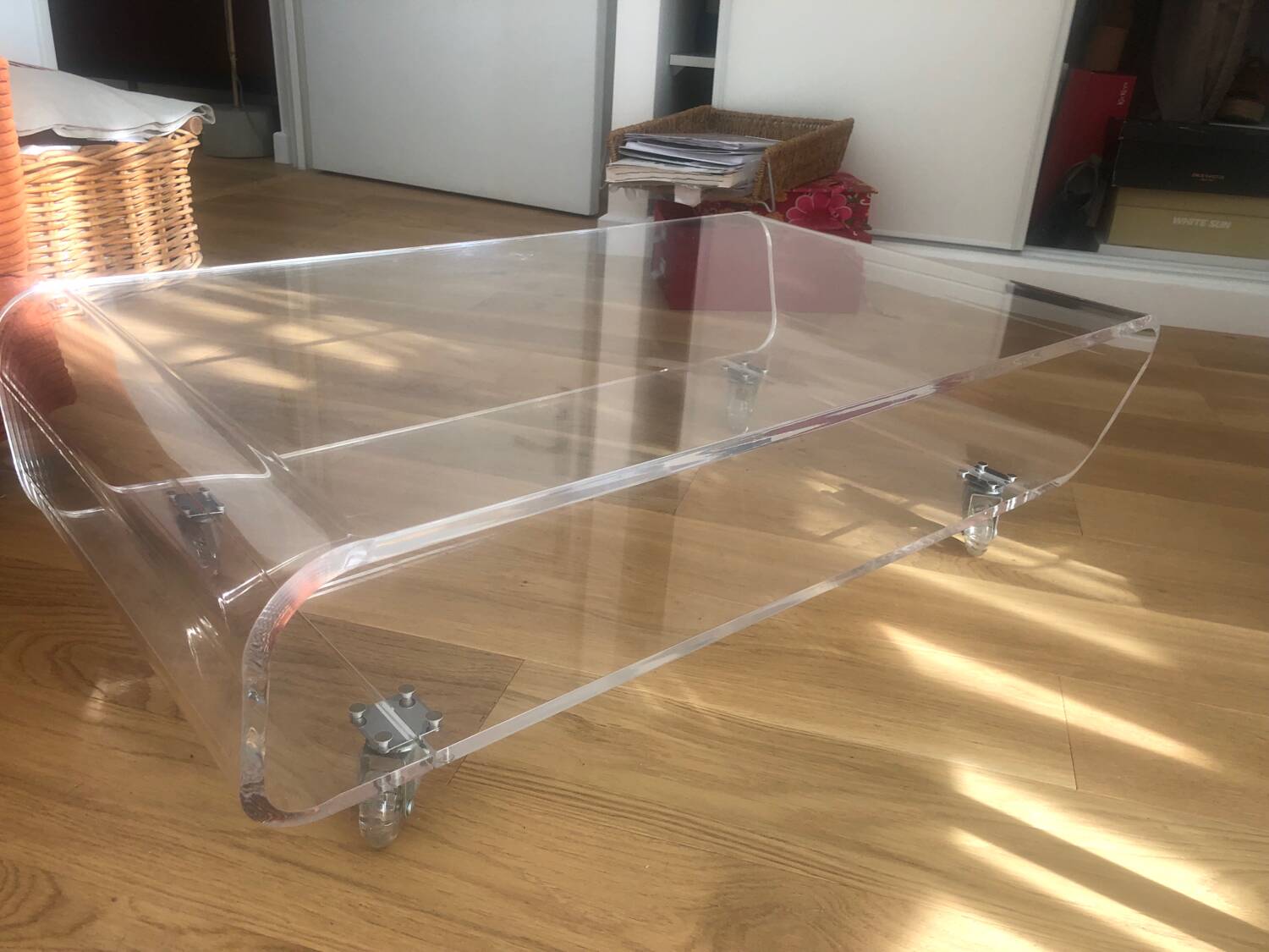 Habitat plexiglass coffee table on wheels