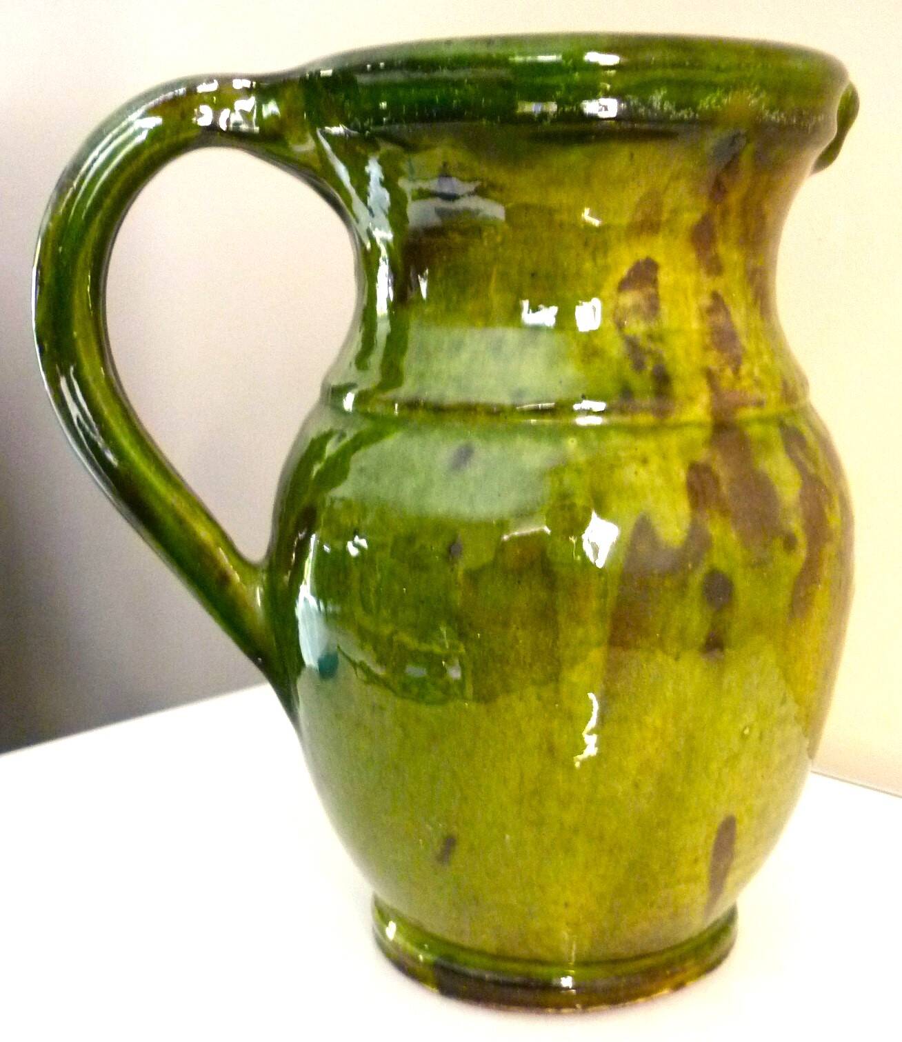 Pitcher vase, thick green glazed terracotta, signature to be identified