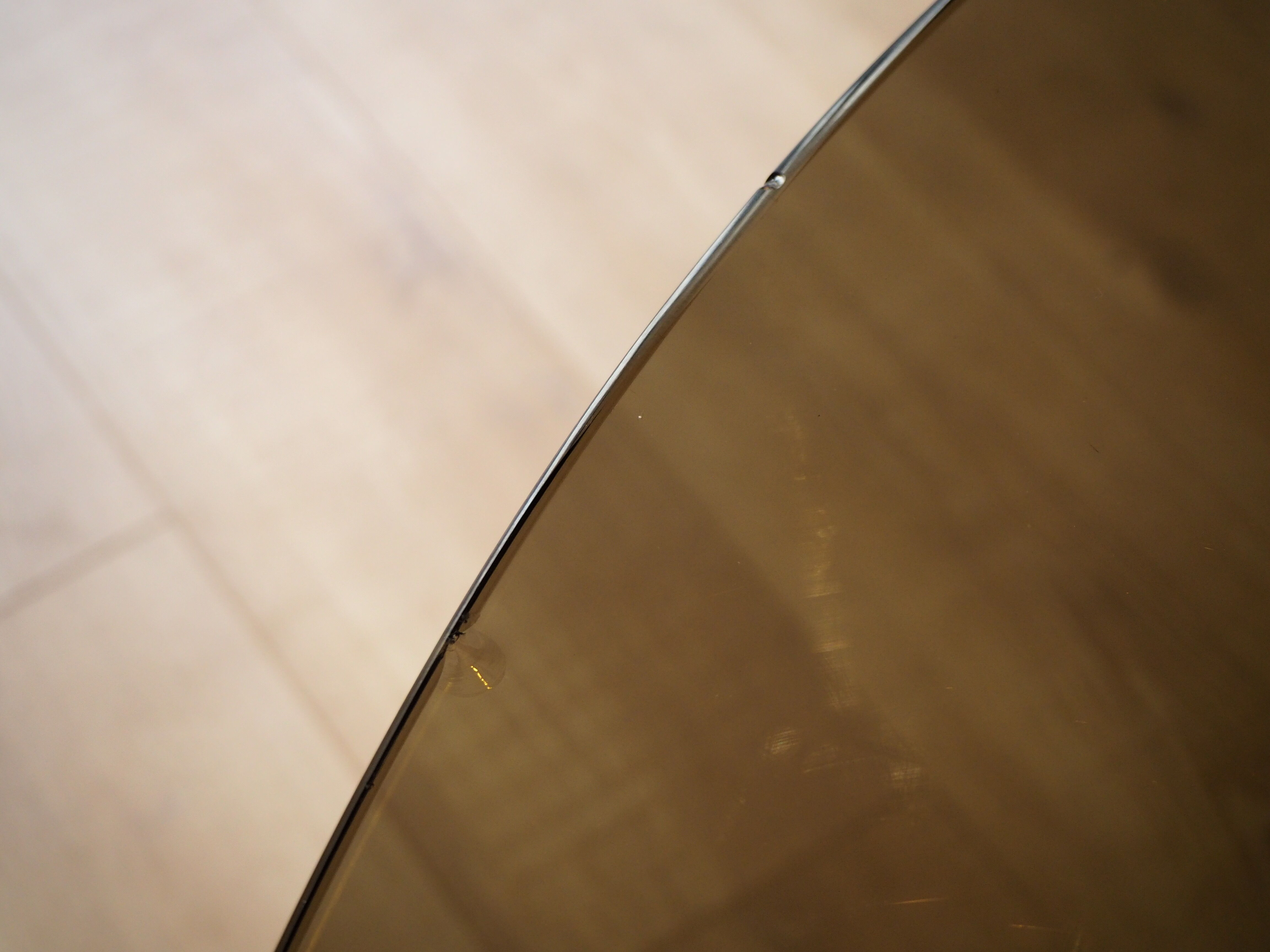 Smoked glass round dining table