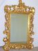 Imposing mirror, carved gilded wood, with Putto decoration