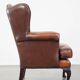 Brown leather wingback Chesterfield armchair