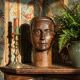 Monoxyle wood sculpture of a man's head, vintage craftsmanship from the 1950s.