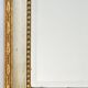 Miroir en bois laqué blanc et or à