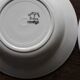 A set of 4 mismatched Art Deco red blue soup plates
