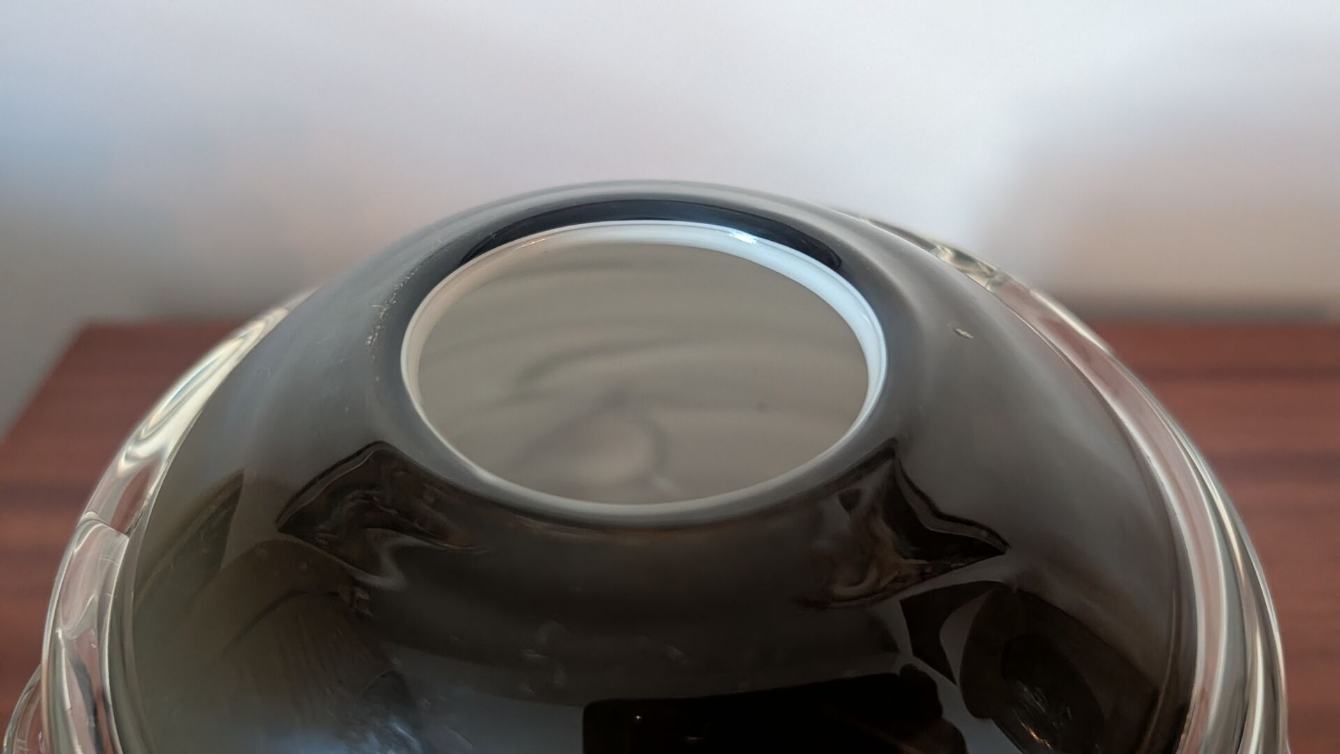 Smoky glass spherical vase with spiral applications from the 1970s.