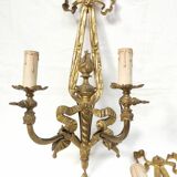Pair of antique bronze wall lights. Louis style candlestick lamps.