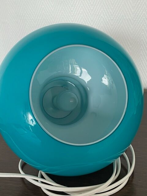 Blue opaline table lamp and vintage Maori fabric