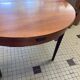 Table ronde en bois avec rallonges intégrées