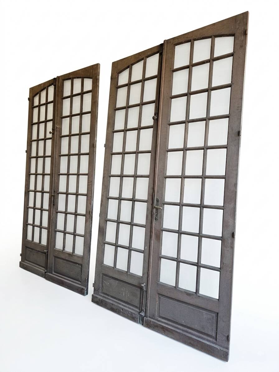 Two pairs of solid oak doors with small panes.