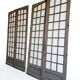 Two pairs of solid oak doors with small panes.