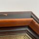Beveled hexagonal mirror with cut wooden sides, gilded edging decoration