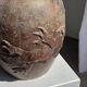 Large traditional Indonesian clay pot featuring a dragon.