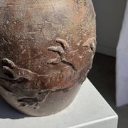 Large traditional Indonesian clay pot featuring a dragon.
