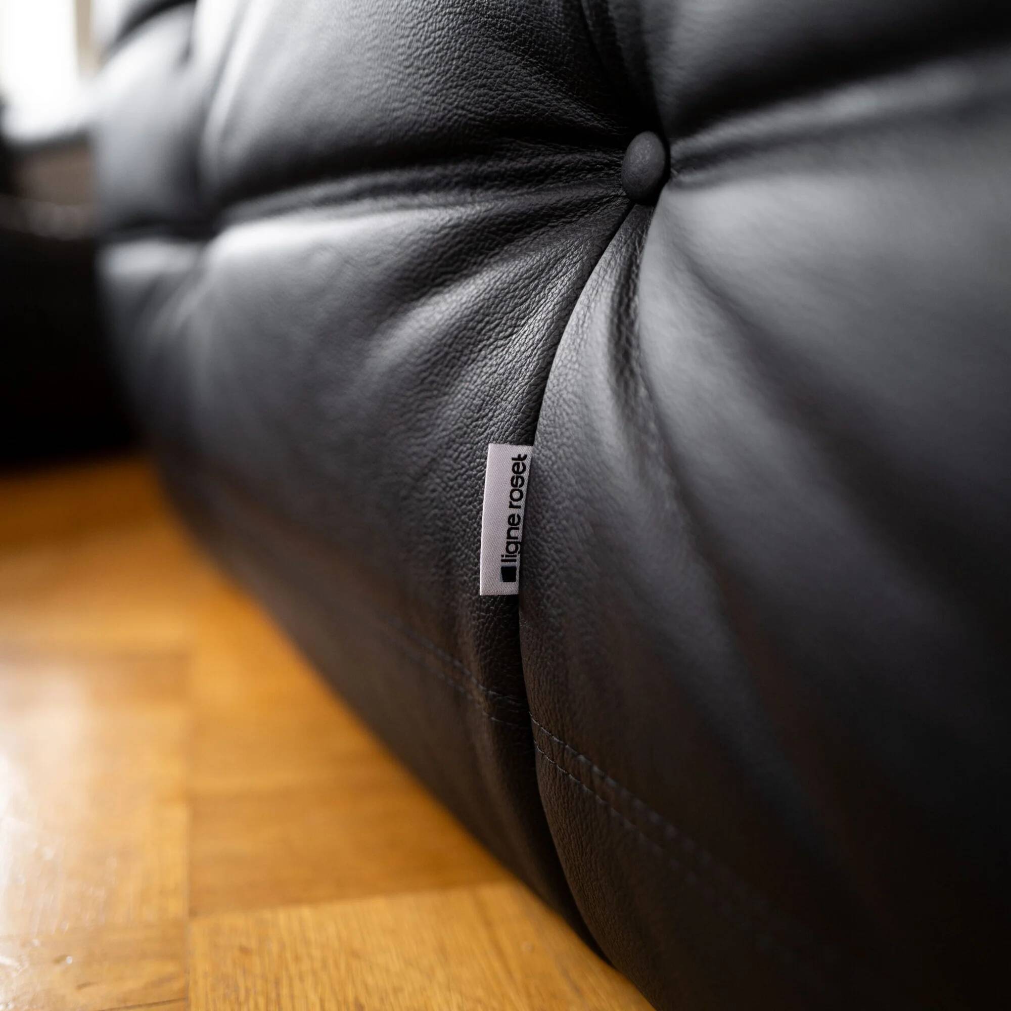 Black leather 2-seater Togo sofa by Michel Ducaroy