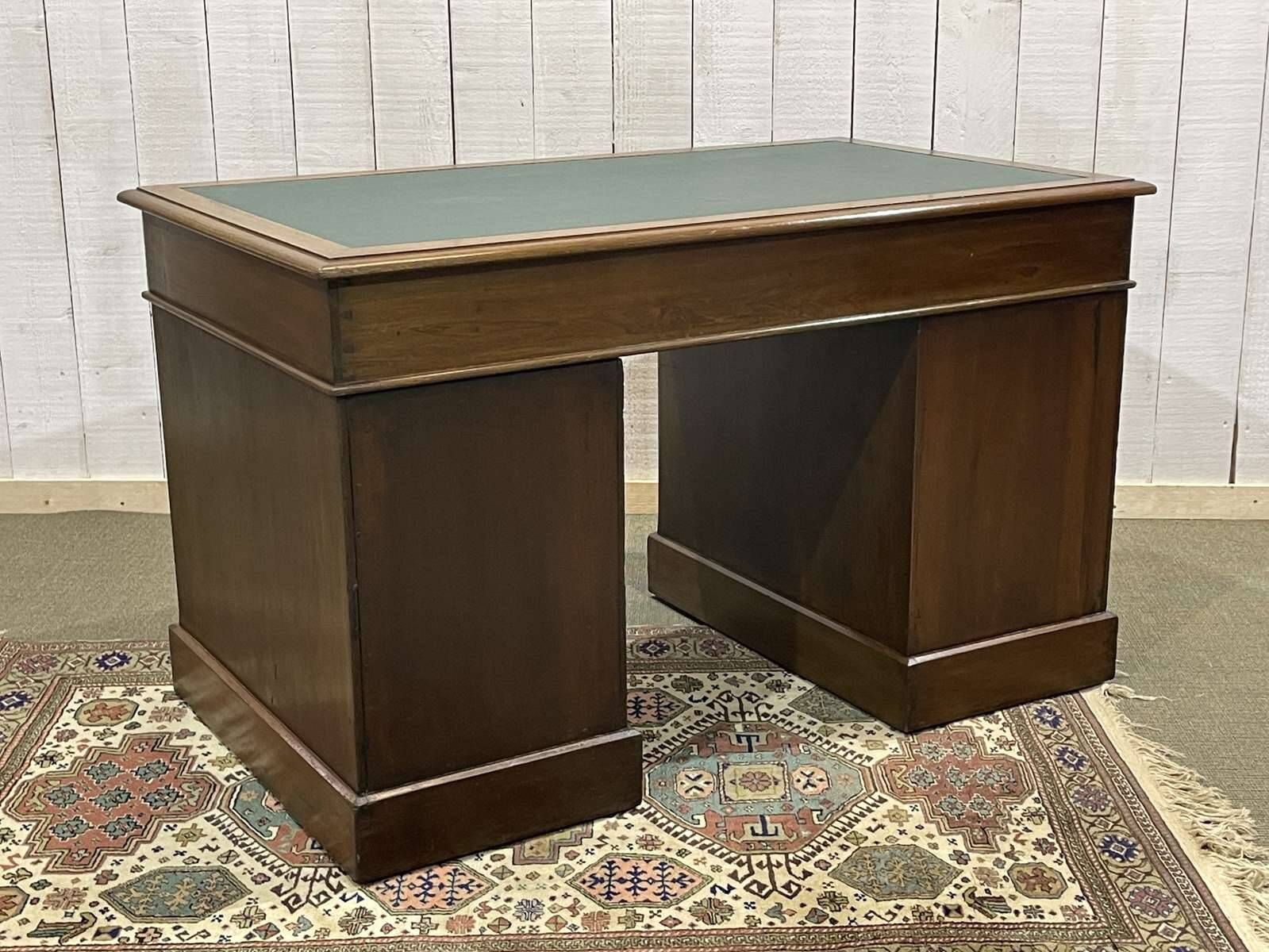 Late 19th century English mahogany desk with pedestals and leather top