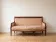 Restoration Empire period canapé bench in carved mahogany.