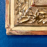 Mirror XIXth medallion on gilded frame with leaf