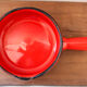 Vintage poelon in bright red glazed ceramic