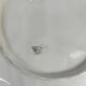 Leaf and strawberry-shaped bowl/strainer.