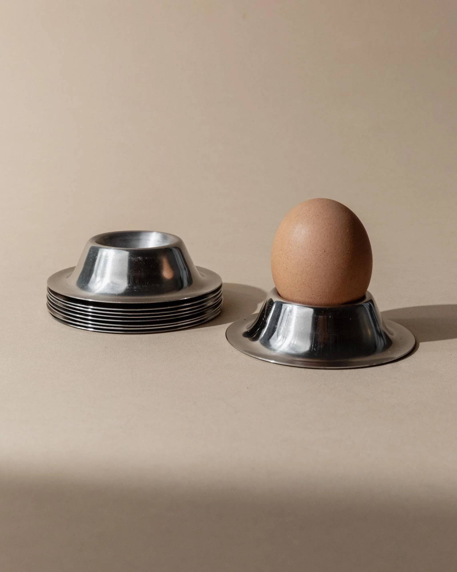 Lot of 9 vintage stainless steel egg cups from the 1970s, timeless minimalist design, dishwasher safe.