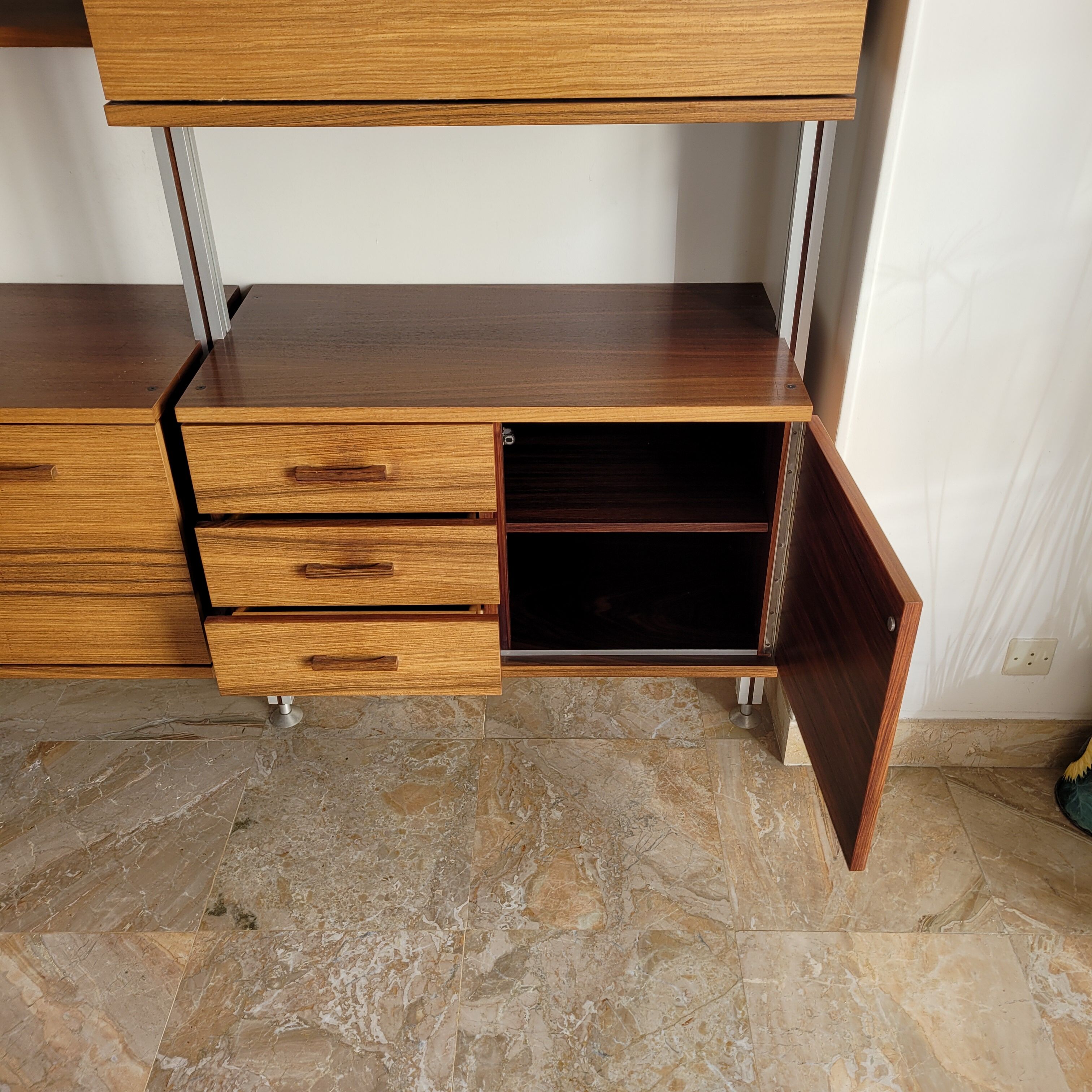 Large Scandinavian wall-mounted wood and aluminum bookcase circa 1960