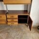 Large Scandinavian wall-mounted wood and aluminum bookcase circa 1960