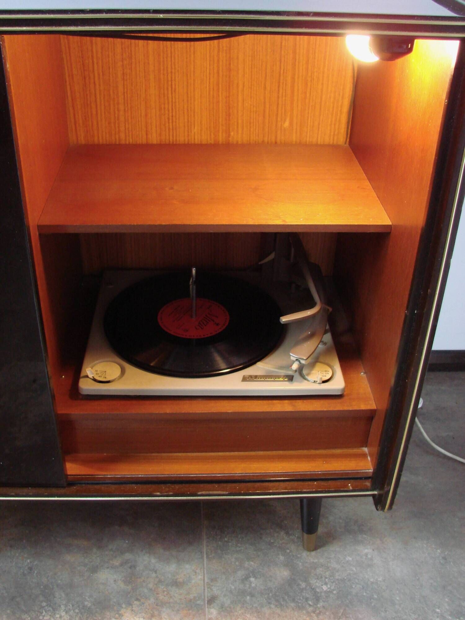 A vintage cabinet with a record player and a bar, 1960s.