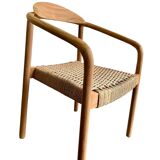 Solid wood chair with woven seat and armrests